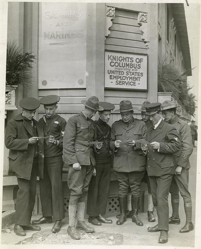 Veterans gather outside Knights of Columbus Employment Center after World War I