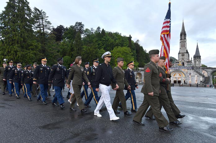 American Military personnel march in a Warriors to Lourdes pilgrimage
